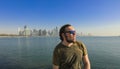 Tourist enjoying the Panoramic View of the Doha city with modern buildings Royalty Free Stock Photo