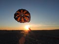 A tourist enjoying Parasailing activity during winter season on the bank of river Brahmaputra in Dibrusaikhowa National Park.