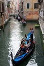 Tourist enjoying a ride on a Gondola, Venice Italy Europe