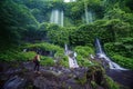 Tourist enjoys a beautiful of Kelambu waterfall