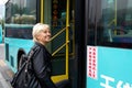 Tourist enters to the bus in China