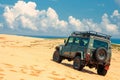 Tourist escapade Yellow sand dunes with a Jeep car Royalty Free Stock Photo