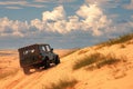 Tourist escapade Yellow sand dunes with a Jeep car Royalty Free Stock Photo