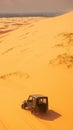 Tourist escapade Yellow sand dunes with a Jeep car Royalty Free Stock Photo