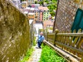 Tourist exploring the hillside of a small village in the Liguria region of Italy