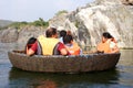 A tourist family on a coracle ride at Hogenakkal Falls, Tamil Nadu Royalty Free Stock Photo