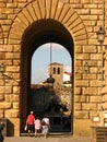 A tourist family entering the Pitti Palace Florenc