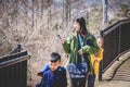 Tourist Family walking up to the Chureito Pagoda shrine to view the Fuji Mountain