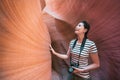 Tourist feeling the rock visiting antelope canyon Royalty Free Stock Photo