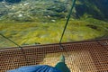 Tourist feet on Dalsnibba platform floor, Norway