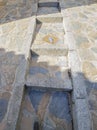 Tourist feet following ceramic tile footprint used to guide visitors, Comares, Malaga, Spain