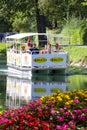 Tourist ferry boat crossing a river. Near lake WÃÂ¶rthersee. Klagenfurt, Austria Royalty Free Stock Photo