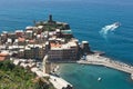 Tourist Ferry Departing from Vernazza on a Sun-Drenched Mediterranean Day Royalty Free Stock Photo