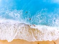 Tourist fighting waves at a beach in Lefkada Greece