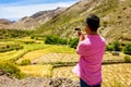 Tourist filming a Valley in the Atlas mountains