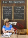 Tourist at a French cafe terrace Royalty Free Stock Photo