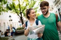 Tourist friends discovering city on foot Royalty Free Stock Photo