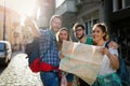 Tourist friends discovering city on foot Royalty Free Stock Photo