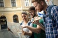 Tourist friends discovering city on foot Royalty Free Stock Photo
