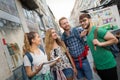 Tourist friends discovering city on foot Royalty Free Stock Photo