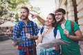 Tourist friends discovering city on foot Royalty Free Stock Photo