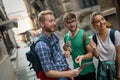 Tourist friends discovering city on foot Royalty Free Stock Photo