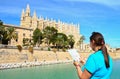 tourist in front of Majorca Palma Cathedral at Balearic Islands