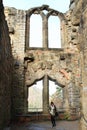 Tourist in front of ruin of Oybin castle and monastery