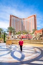 Tourist in front of Treasure Island Hotel