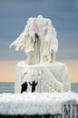 Tourist and frozen lighthouse