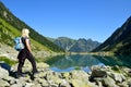 Tourist at Gaube lake in the Pyrenees mountains. Royalty Free Stock Photo