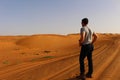 A Tourist Gazes out at the Vastness of the Wahiba Sands in Oman