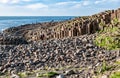 Tourists on Giants Causeway in Northern Ireland