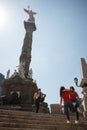 Tourist girfriends taking picture together, Angel de la Indepedencia