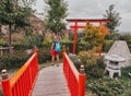 Tourist girl admires Japanese gardens in National Botanical Garden of Tbilisi Royalty Free Stock Photo