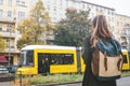 Girl tourist with a backpack on Berlin street in Germany