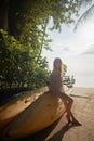 girl sitting on a boat at sunset