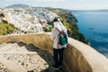 Tourist girl in the city of Fira on the island of Santorini in Greece Royalty Free Stock Photo