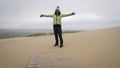 Tourist girl among Curonian Spit sand dunes Royalty Free Stock Photo