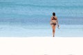 Tourist girl with a diving mask on the snorkeling area near the