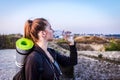 A tourist girl drinks water in bright sunlight Royalty Free Stock Photo