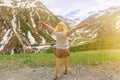 Tourist girl enjoing the Fluela Pass view