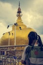 Tourist girl entering to golden rock pagoda.