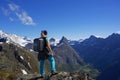 Tourist girl hikes the Romsdalseggen ridge, Norway Royalty Free Stock Photo