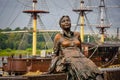 Tourist girl decoration near the river ship in Veliky Novgorod