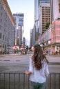 Girl observing the rush of Nathan Road in Kowloon Hong Kong Royalty Free Stock Photo