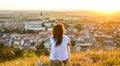 Tourist girl overlooking Mikulov Castle, Moravia, Czech Republic