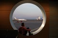 Tourist girl sitting at the airport window Royalty Free Stock Photo