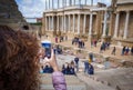 Tourist girl taking a picture in the antique Roman Theatre of Merida, Spain. Royalty Free Stock Photo
