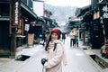 Tourist Girl and unidentify people in Takayama Japan